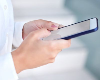 Woman Using Smartphone at Work Close Up